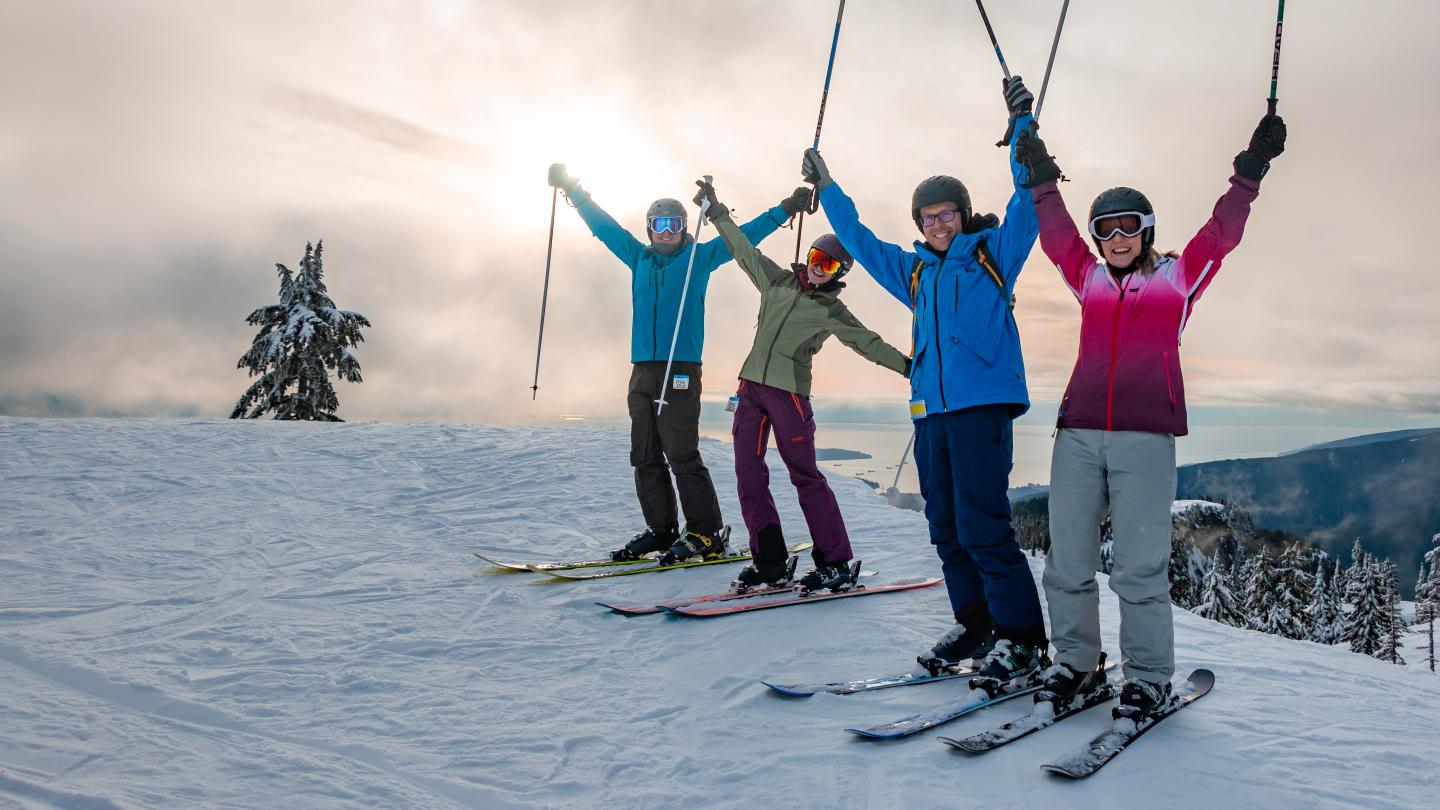 friends posing with poles in the air