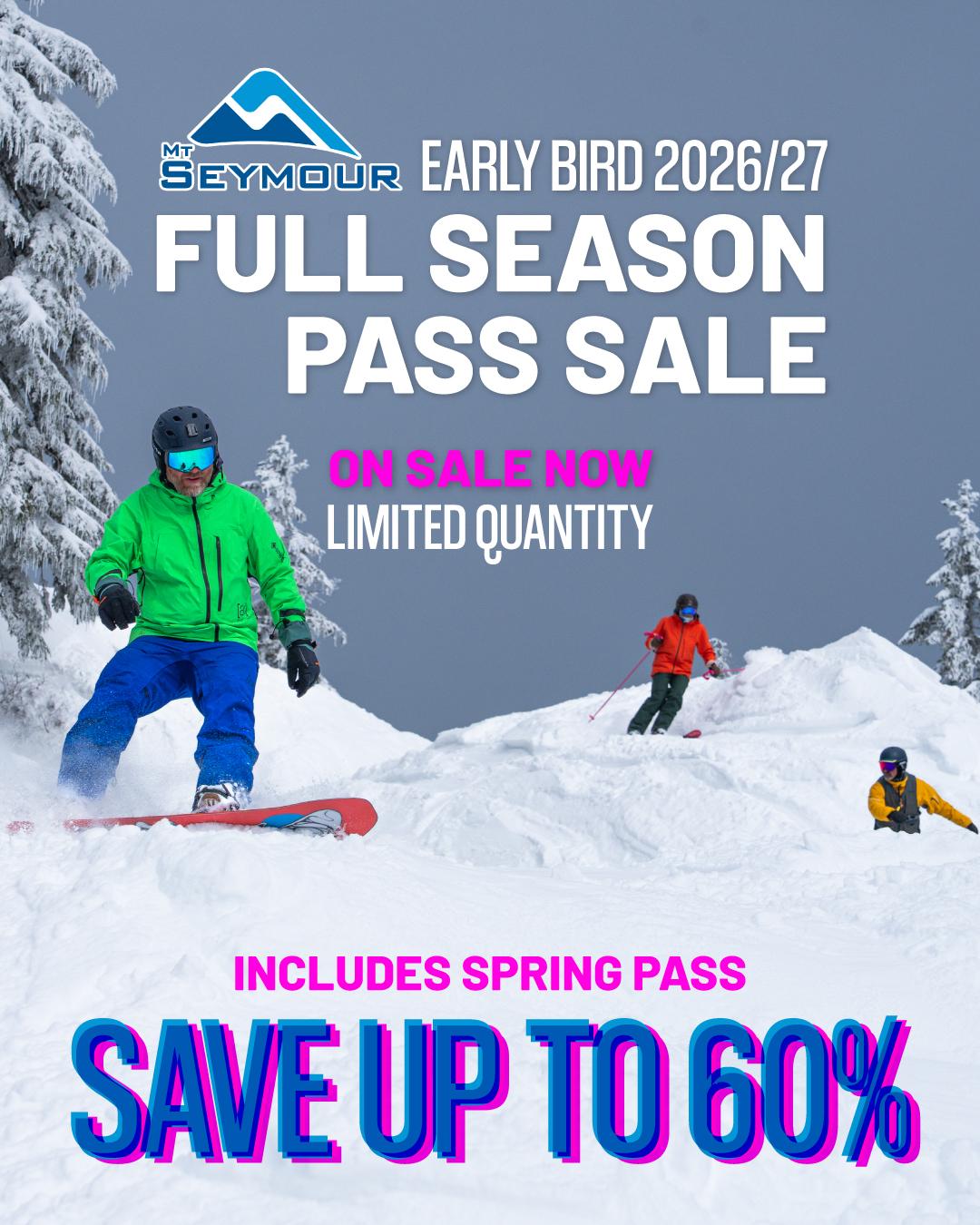 Skiers on a snowy slope beneath a bright sky.